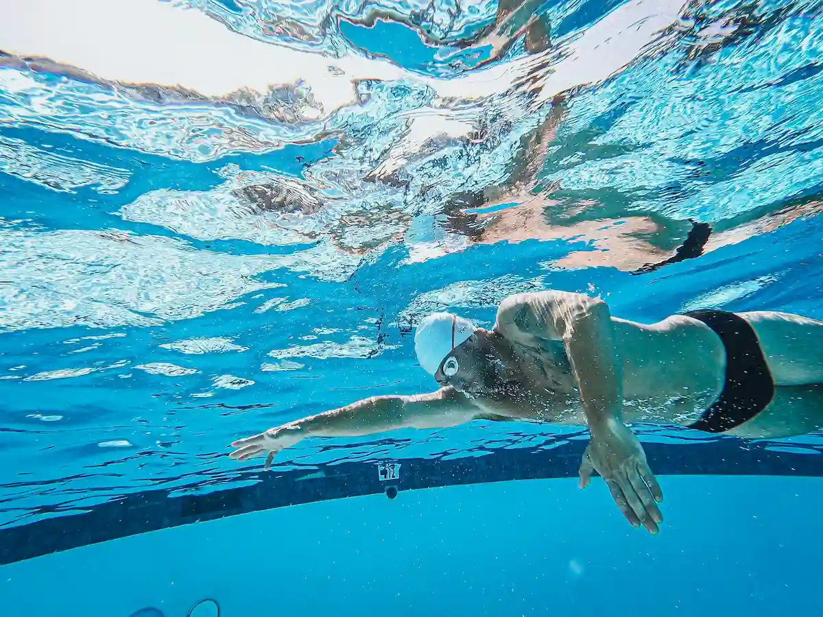 Underwater view of a swimmer's pull during a backstroke technique coaching session